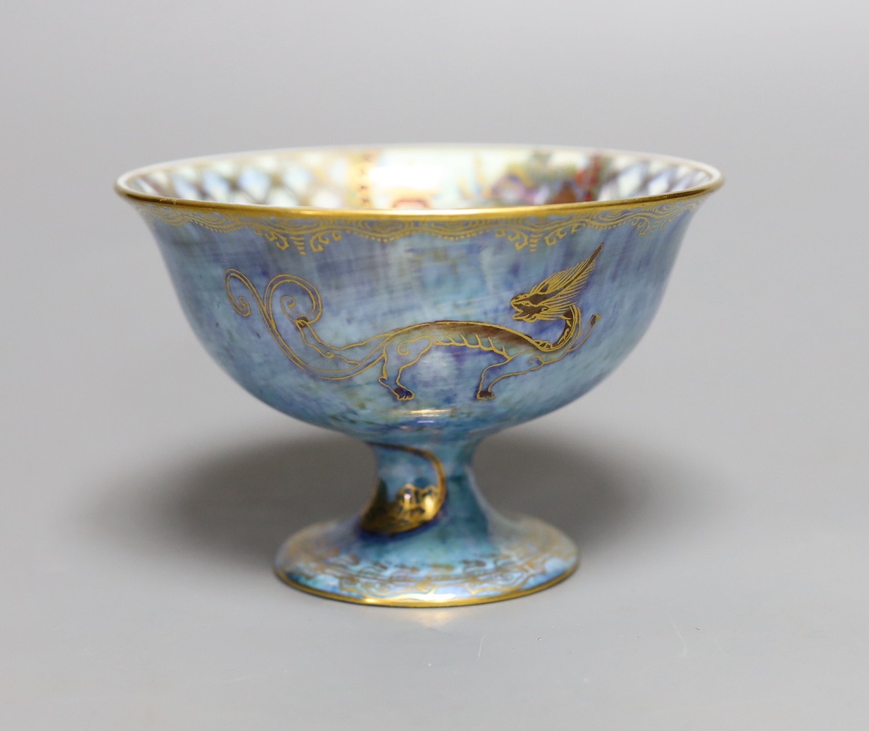 A Wedgwood blue lustre chinoiserie pedestal bowl, designed by Daisy Makeig Jones, pattern number Z4829, 8 cms high